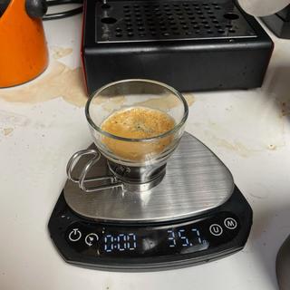 Espresso cup sitting on a scale showing a weight of 35.6g